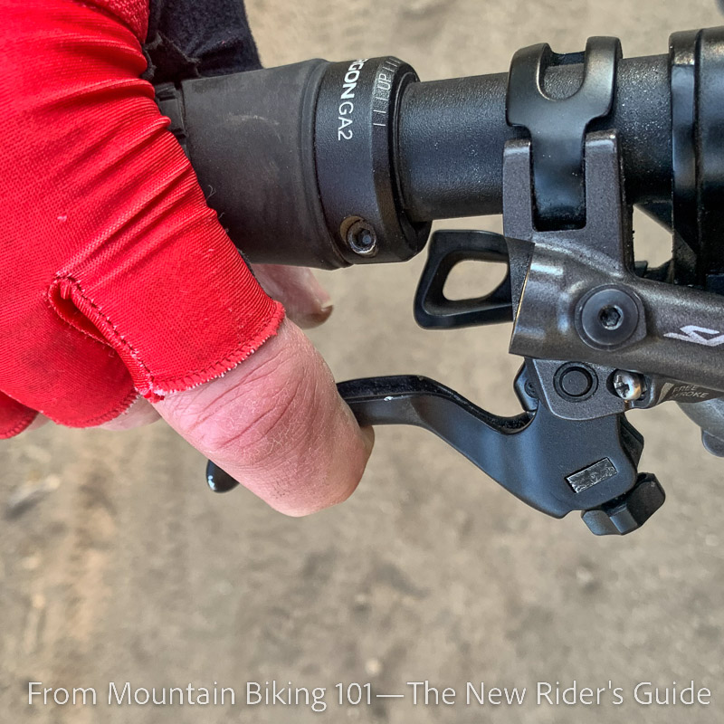Using one finger on the bike's brake lever
